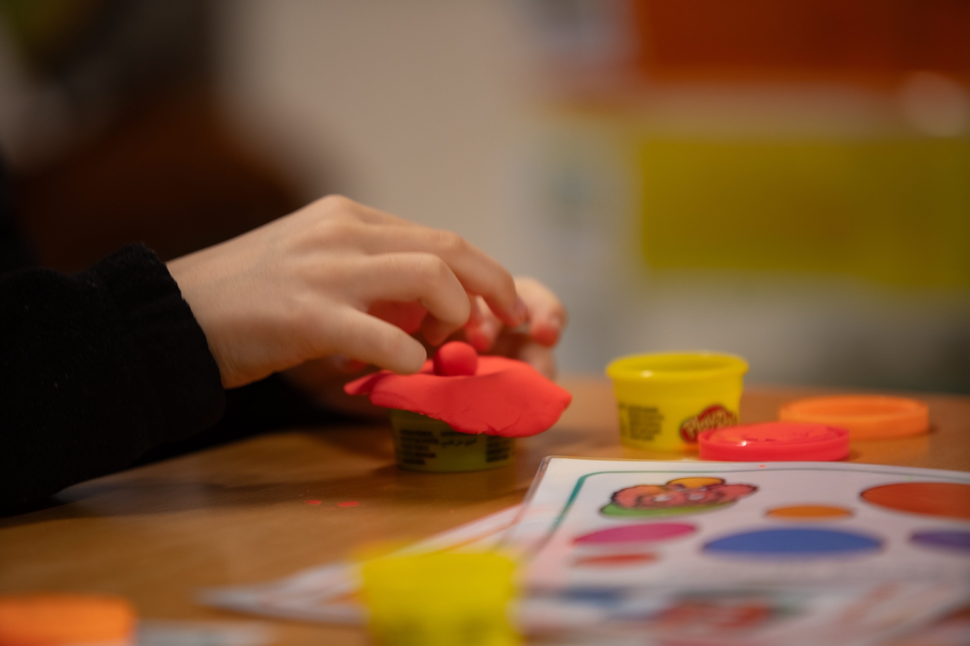 children hands playing with resources